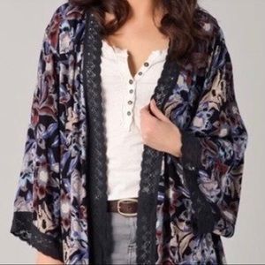 Dark floral print bed jacket.